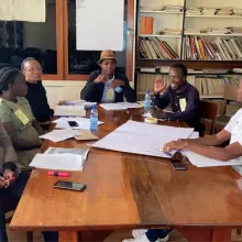 People have a discussion around a table 