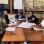 People have a discussion around a table 